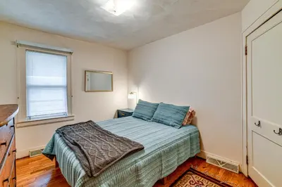 a bedroom with a bed and a window at Home 7 Mi to Binghamton University! in Vestal