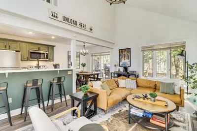 a living room with a couch and a table at Steps to Jack Frost Ski Resort Townhome with Decks in White Haven