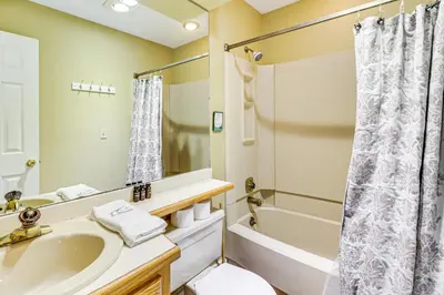 a bathroom with a sink and a tub and a shower at Steps to Jack Frost Ski Resort Townhome with Decks in White Haven