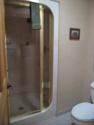 a bathroom with a glass shower with a toilet at The Inn & Spa at Intercourse Village in Intercourse