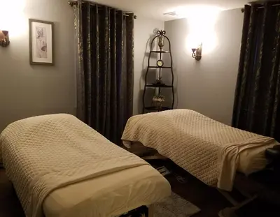 a room with two beds and a shelf with lights at The Inn & Spa at Intercourse Village in Intercourse