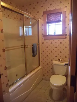 a bathroom with a shower and a toilet and a window at The Inn & Spa at Intercourse Village in Intercourse