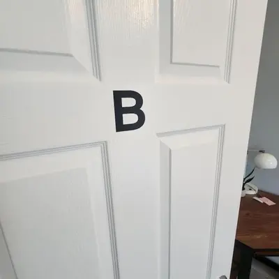 a door with the letter b on the wall at Private Bedroom In Shared Apt B in South Hackensack