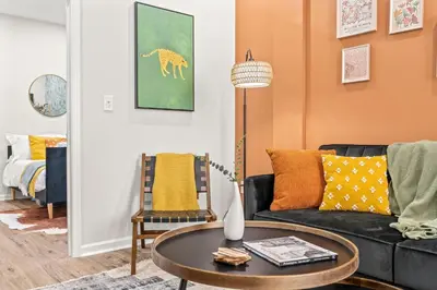 a living room with a couch and a table at Stylish 1BR 1,5BA Old City Condo Near Liberty Bell in Philadelphia