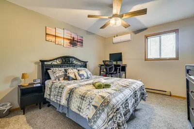 a bedroom with a bed and a ceiling fan at Home with Fire Pit in Jim Thorpe 6 Mi to Dtwn! in Jim Thorpe