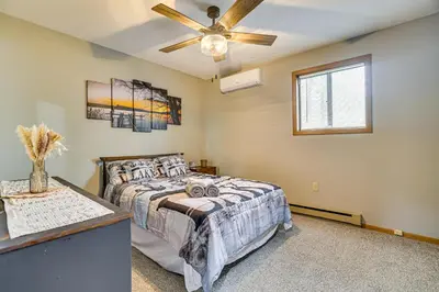 a bedroom with a bed and a ceiling fan at Home with Fire Pit in Jim Thorpe 6 Mi to Dtwn! in Jim Thorpe