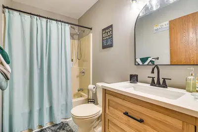 a bathroom with a sink and a toilet and a shower at Home with Fire Pit in Jim Thorpe 6 Mi to Dtwn! in Jim Thorpe