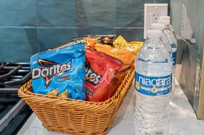 a basket of chips and a bottle of water at Historic Old City 1BR 1BA Near Independence Hall in Philadelphia