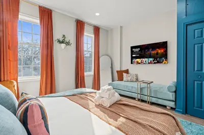 a living room with a bed and a couch at Historic Old City 1BR 1BA Near Independence Hall in Philadelphia