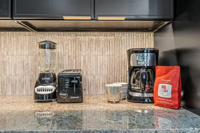 a kitchen counter with a blender and other appliances at Old City History Kid-Friendly 2BR 1,5BA in Philadelphia