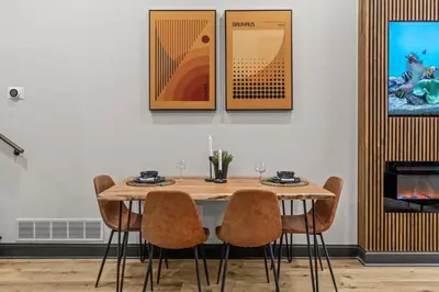 a dining room with a wooden table and chairs at Old City History Kid-Friendly 2BR 1,5BA in Philadelphia