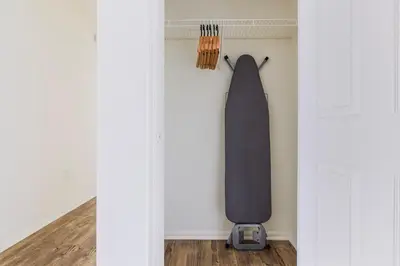 a skateboard hanging on a wall in a room at Blueground Hudson Exchange pool nr Liberty Park NYC-1800 in New York