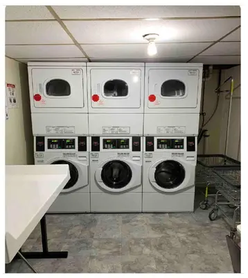 four washing machines stacked on top of each other at Hudson Guest House in Jersey City