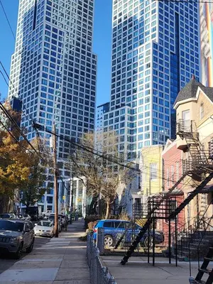 a city street with tall buildings in the background at Hudson Guest House in Jersey City