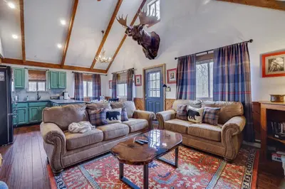 a living room with two couches and a table at Moose Tracks Cabin Hot Tub 5 Min to Slopes in Lake Harmony