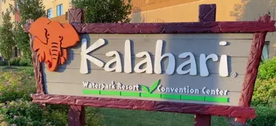 a sign for a kahari research hospital convention center at Lakeside Escape at StillwaterHot Tub & Ski in Pocono Summit
