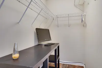 a desk with a laptop computer on top of it at Lakeside Escape at StillwaterHot Tub & Ski in Pocono Summit