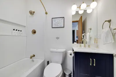 a bathroom with a tub and a toilet and a sink at Serene Escape at Big Bass Lake & Pool Access in Clifton