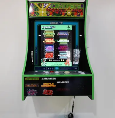 a video game machine is shown on display at Serene Escape at Big Bass Lake & Pool Access in Clifton
