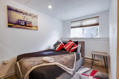 a small bedroom with a bed in a room at Husky Hideaway-Hot Tub, 1 Mile Lake & Ski in Lake Harmony