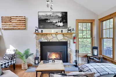 a living room with a fireplace and a couch at Mountainview Vista 1 Mile to Water Park & Ski in Tannersville