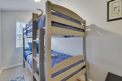 a bunk bed in a bedroom with a bunk bed in a room at Lakeside Escape Hot Tub Private Dock Ski in Tobyhanna