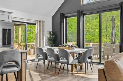 a dining room with a table and chairs at Pickleball & Basketball Court Hot Tub Luxury in Albrightsville