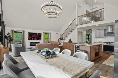 a kitchen and living room with a table and chairs at Pickleball & Basketball Court Hot Tub Luxury in Albrightsville
