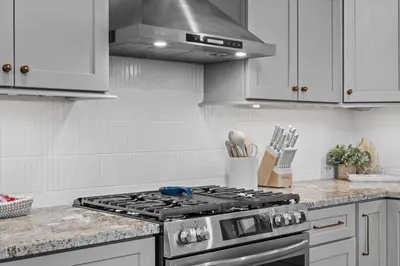 a kitchen with a stainless steel stove top oven at Pickleball & Basketball Court Hot Tub Luxury in Albrightsville