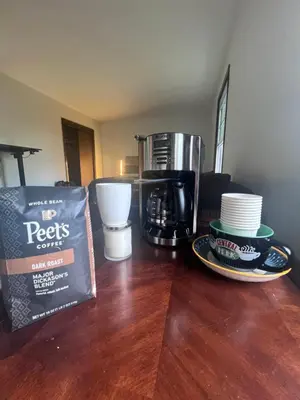 a coffee maker and a bag of coffee on a table at Cozy Budd Lake Cul-de-Sac Home Lodge in Mount Olive