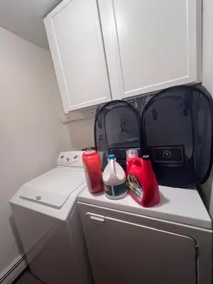 a small refrigerator with a bag on top of it at Cozy Budd Lake Cul-de-Sac Home Lodge in Mount Olive