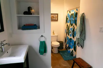 a bathroom with a white sink and a toilet at Mountain Laurel Bungalow Lakeview & Ski in Lake Harmony