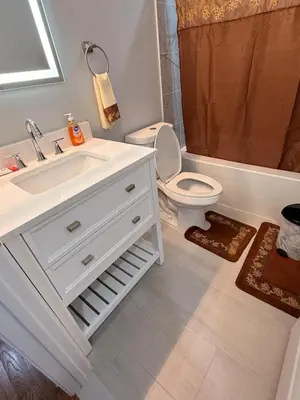 a bathroom with a sink and a toilet and a shower at The great homes in East Orange