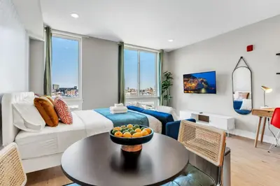 a living room with a couch and a table at Scenic City Studio - Walkable - Smart TV in Philadelphia