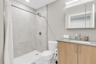 a bathroom with a shower and a toilet and a sink at Scenic City Studio - Walkable - Smart TV in Philadelphia