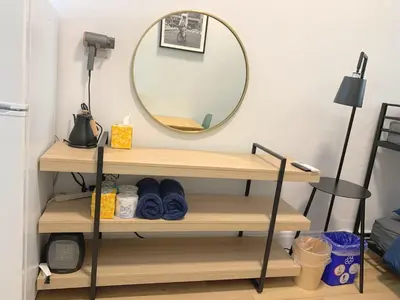 a mirror on a shelf in a room at Chelsea Studio-Shared Bathroom with Kitchen Twin Bunk Bed in New York