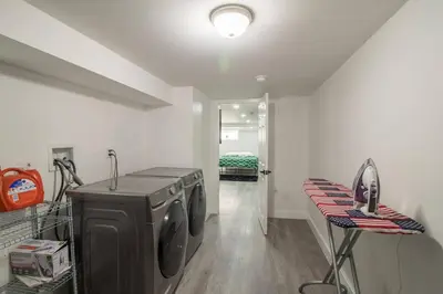 a laundry room with a washer and dryer in it at Home in Philadelphia Stadium nearby in Philadelphia