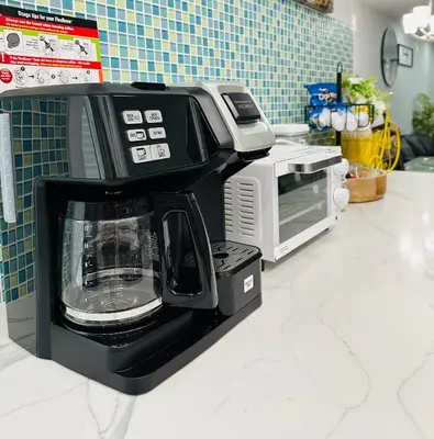 a black coffee maker sitting on top of a counter at Home in Philadelphia Stadium nearby in Philadelphia
