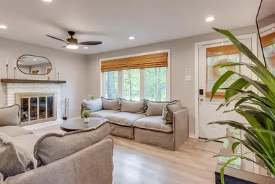 a living room with a couch and a fireplace at Game Room and Deck Family Home in Tobyhanna! in Tobyhanna