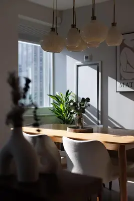 a dining room with a table and chairs and a mirror at RARE Luxurious Apartment 1 Block From Time Square in New York