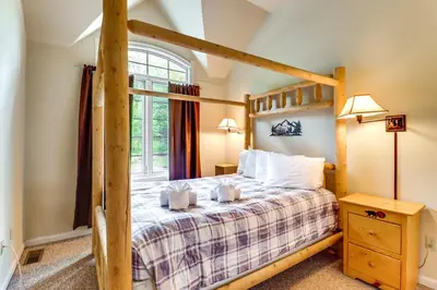 a bedroom with a bunk bed and a window at Less Than 1 Mi to Big Boulder Mtn! Home with Hot Tub and Deck in Lake Harmony