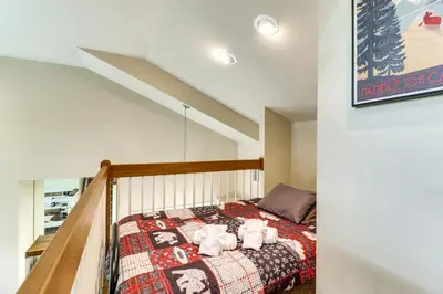 a bedroom with a bed with towels on it at Less Than 1 Mi to Big Boulder Mtn! Home with Hot Tub and Deck in Lake Harmony