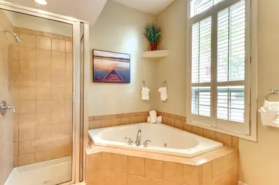 a large bathroom with a tub and a shower at Less Than 1 Mi to Big Boulder Mtn! Home with Hot Tub and Deck in Lake Harmony