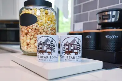 a mason jar filled with popcorn and a jar of corn at Bool Bear Lodge a pet friendly Pocono Vacation Home with Fireplace, BBQ and more in Tobyhanna