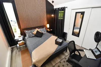 a bedroom with a bed with pillows on it at Bool Bear Lodge a pet friendly Pocono Vacation Home with Fireplace, BBQ and more in Tobyhanna