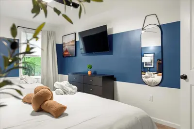 a bedroom with two teddy bears on a bed at 5 Br Sleeps 14 Hot Tub-Sauna-Movie Theatre-Arcade in Albrightsville