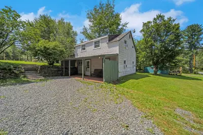 a home with a barn with a yard at Harmony House in Liberty
