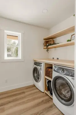 a laundry room with a washer and dryer at Modern Amish Country Retreat w/ Hot Tub. in Leola