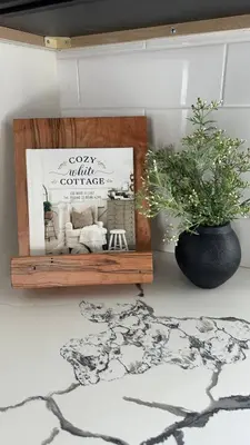 a wooden shelf with a picture and a potted plant at Modern Amish Country Retreat w/ Hot Tub. in Leola