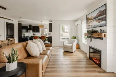 a living room with a couch and a fireplace at Modern Amish Country Retreat w/ Hot Tub. in Leola